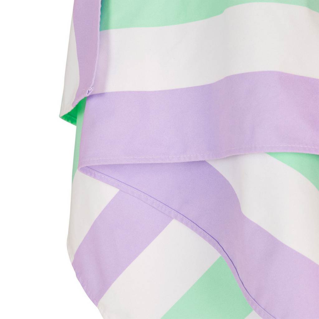 Close up of Dock & Bay fast-drying summer beach towel in Lavender Fields featuring lilac purple and mint green stripes