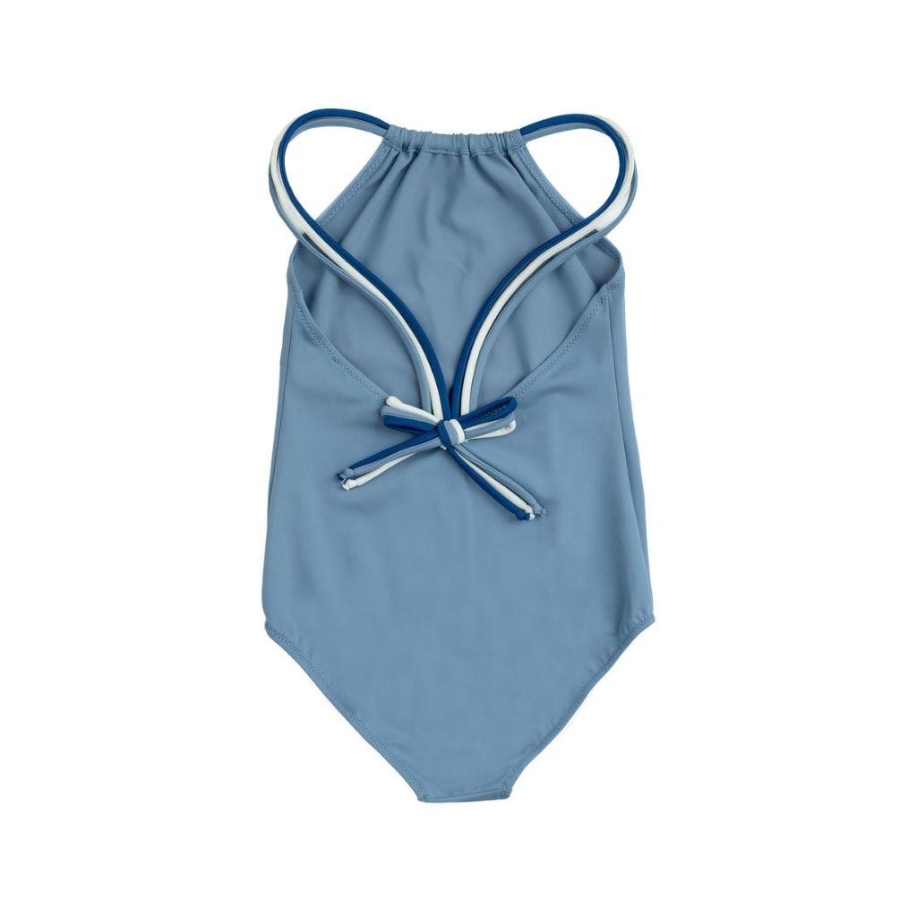 Back of the Folpetto Frida one piece swimsuit in dusty blue, midnight and ivory