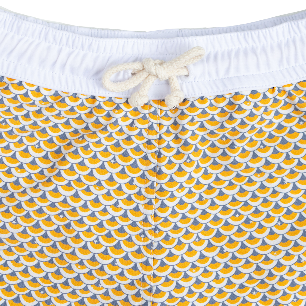 Folpetto Tommaso swim shorts for boys in mango yellow and pebble grey scales print