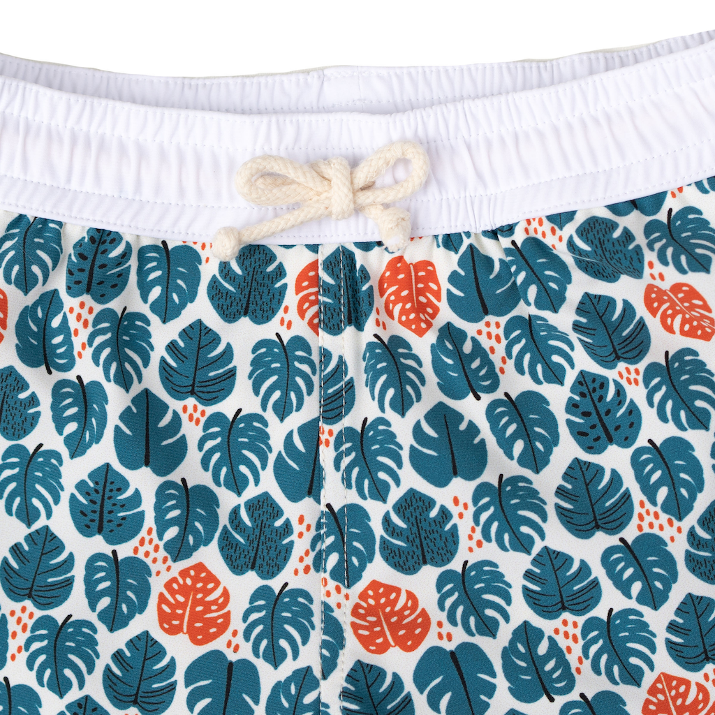 Folpetto Tommaso swim shorts for boys in teal blue and mandarin red tropical leaf print