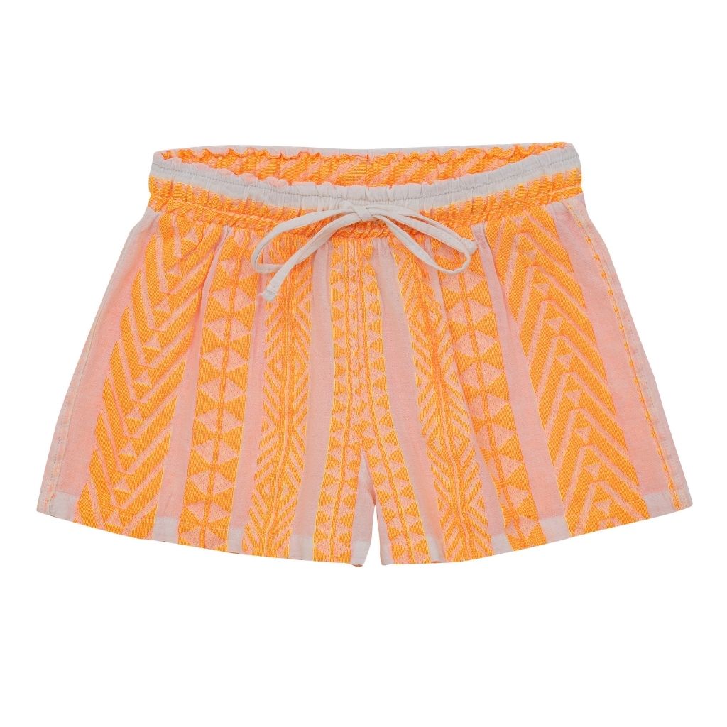 The Kelly shorts in neon orange from the children's line of Greek brand, Devotion Twins  Edit alt text