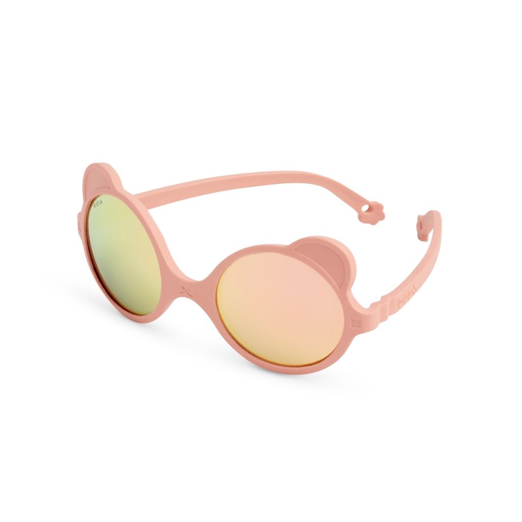 Side view of Ki et La children's Ours'on teddy bear sunglasses in peach pink