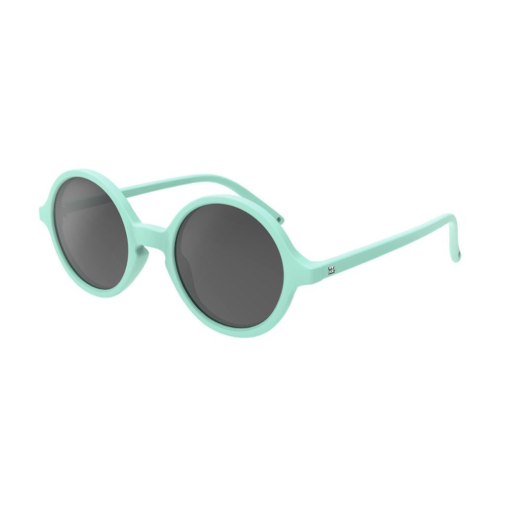 Side view of Ki et La Woam round lens children's sunglasses in bright green