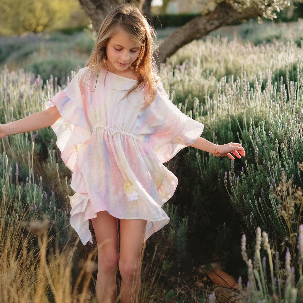 Little girl wearing the Lison Paris Moorea Pastel kaftan cover -up