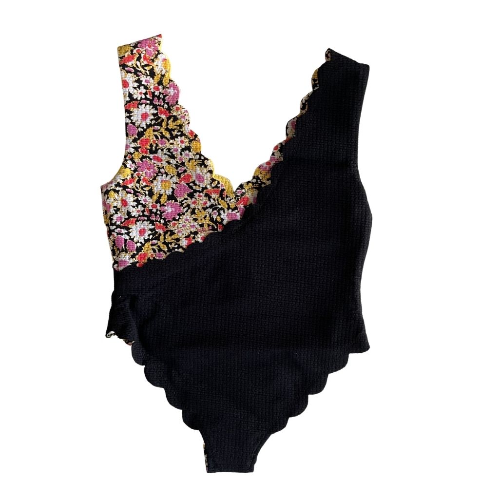 Front view of Marysia Bumby Canyon Point reversible swimsuit in black and blossom flower and yellow and blossom flower print