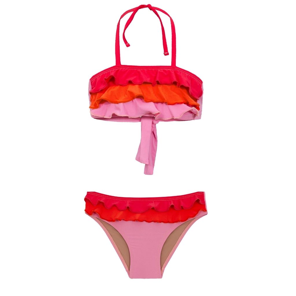 Flatlay of PQSwim girls Ava ruffle bikini in pink, orange and red