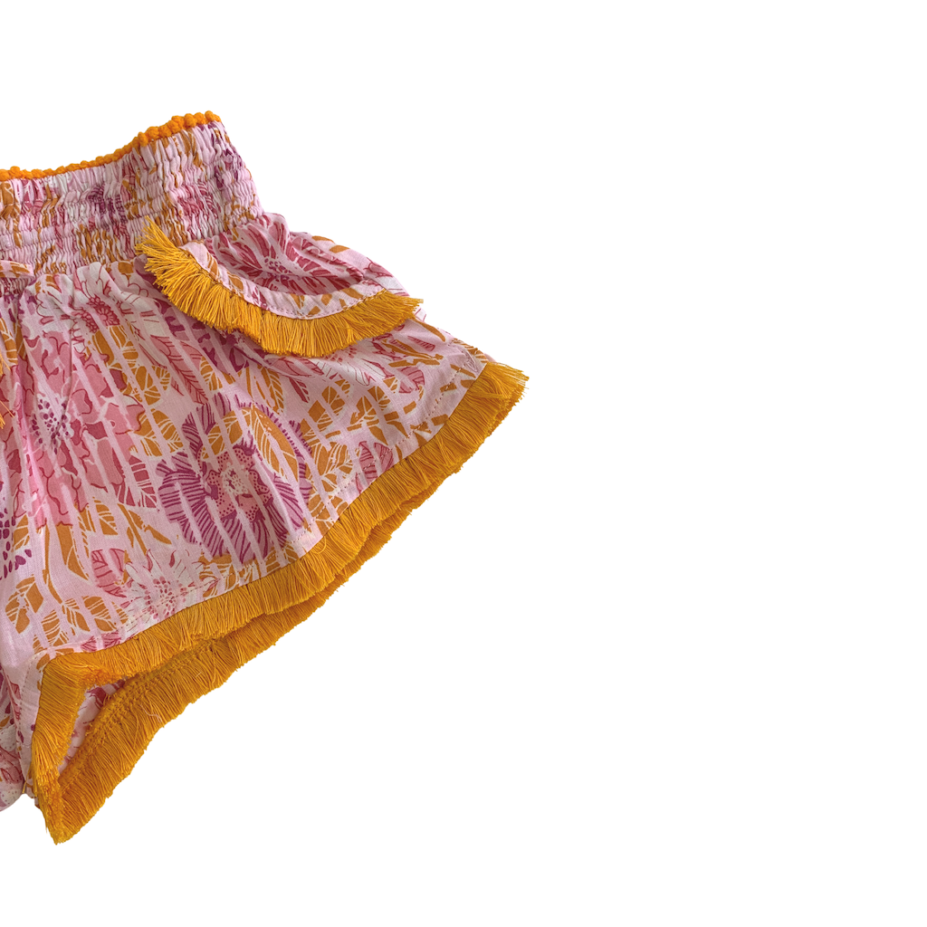 Fringe detail on Poupette St Barth Children's Lulu Lace Trimmed Boxer Shorts in Pink Marigold print
