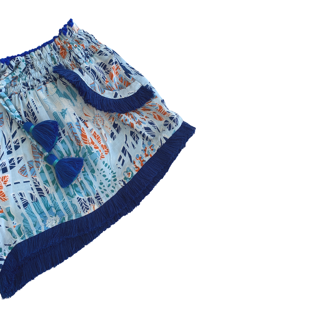 Fringe detail on Poupette St Barth Children's Lulu Lace Trimmed Boxer Shorts in Sky Blue Marigold print