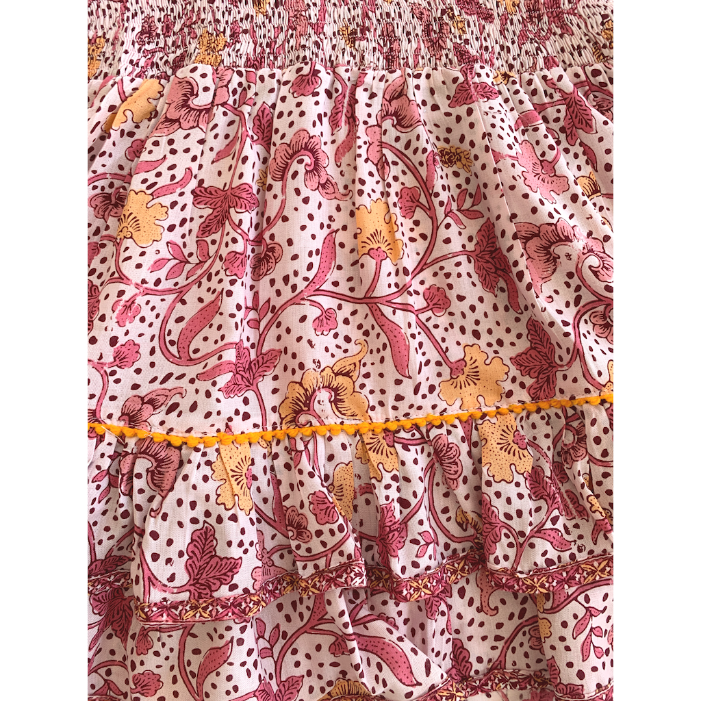 Pattern detail on Poupette St Barth Children's Camila Ruffled Mini Dress in Pink Clary