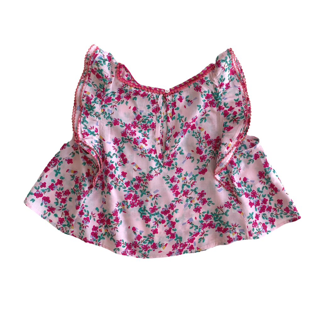 Back of Poupette St Barth Children's Amber Pleated top blouse in pink kookoo bird print