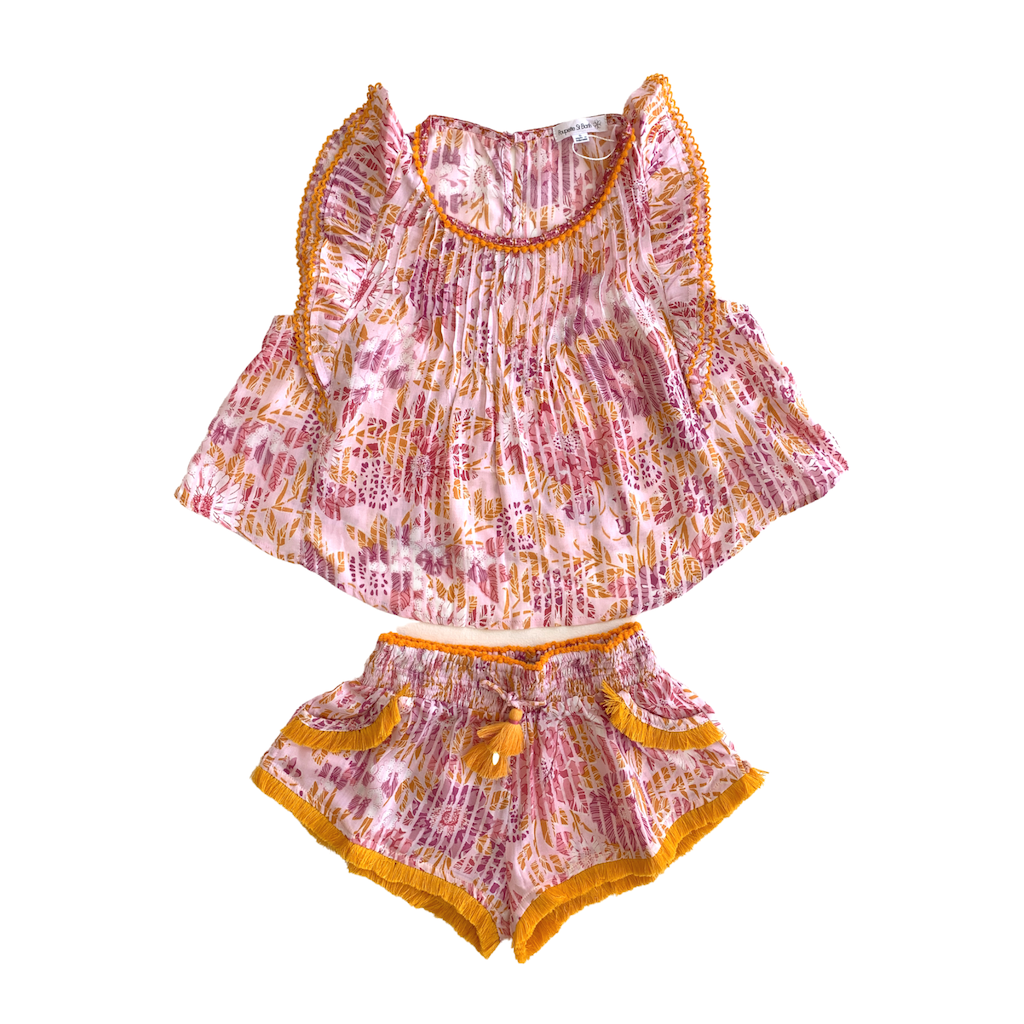 Poupette St Barth Amber Pleated Top in Pink Marigold with matching boxing shorts from the Poupette St Barth Childrenswear line