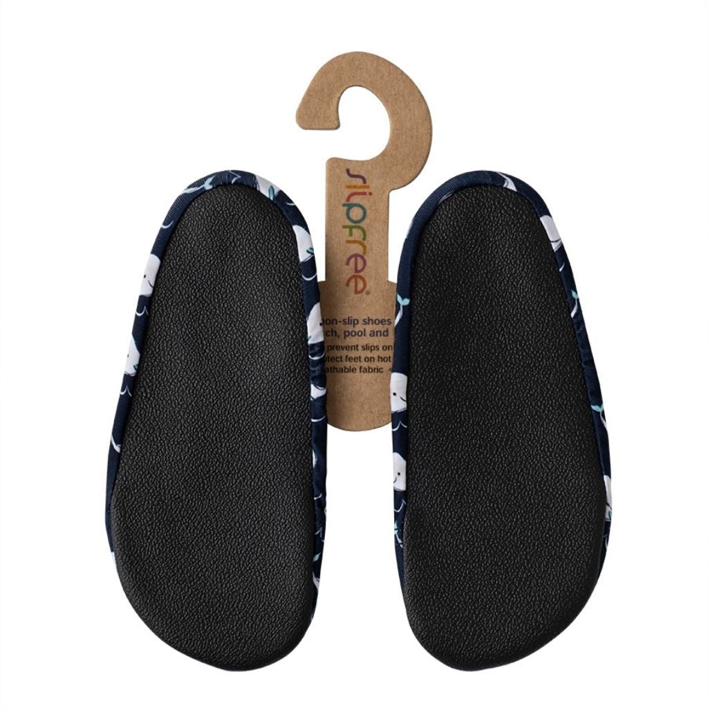 Sole view of the Willy non-slip children's shoe from Slipfree in a navy and white whale print