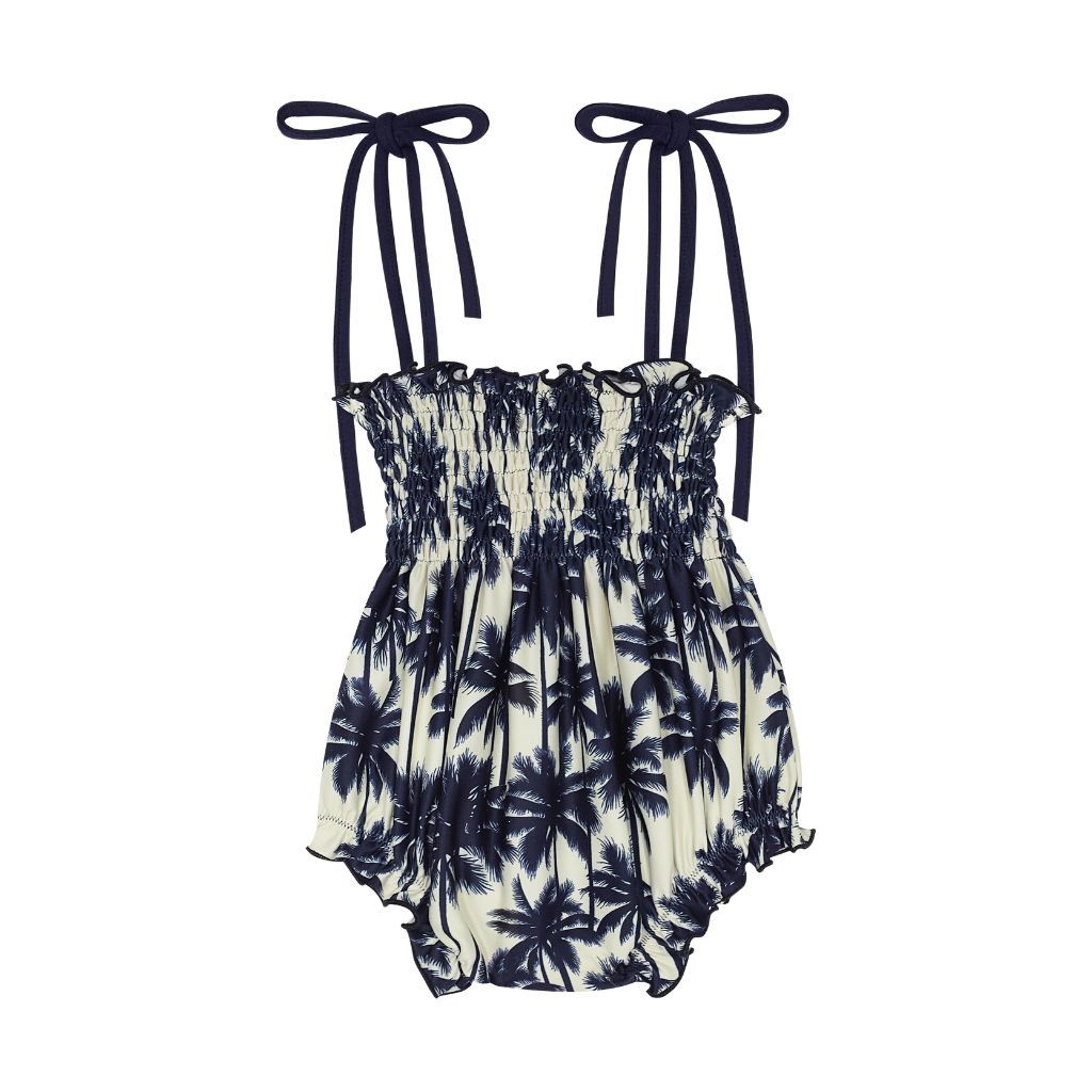 Front of the Suncracy Palms Menorca Bubble Baby Girls Swimsuit featuring palm tree print