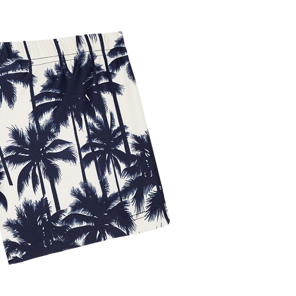 Close up of the Suncracy Palms Menorca Lycra Swim Shorts for Baby Boys featuring a Palm Tree print