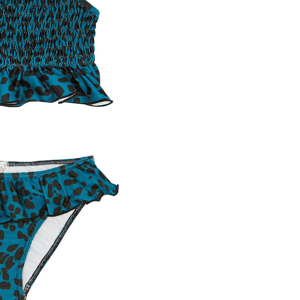 Close up of the fabric of the Suncracy Teal Animal Print Sardinia Smocked Two Piece Bikini for Girls