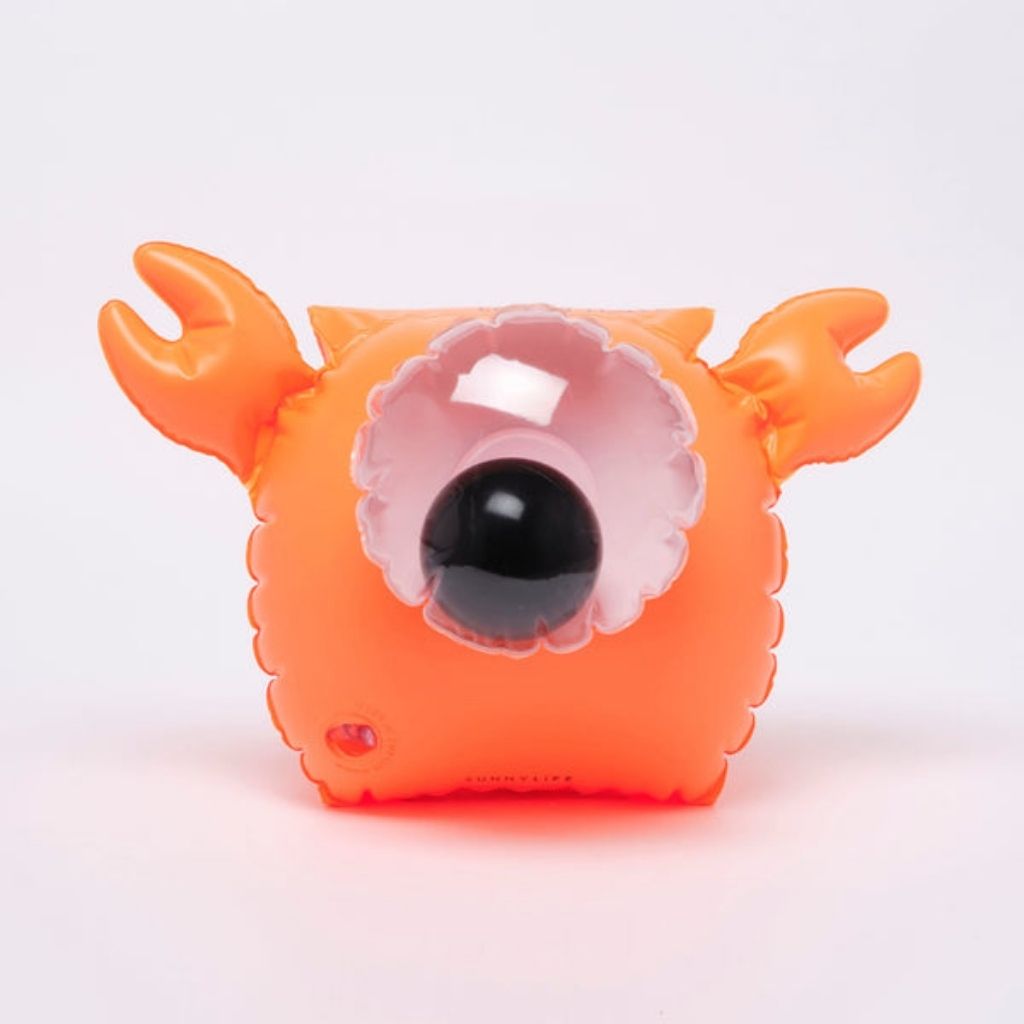 Close up of Sunnylife kids buddy float bands in sonny the sea creature neon orange