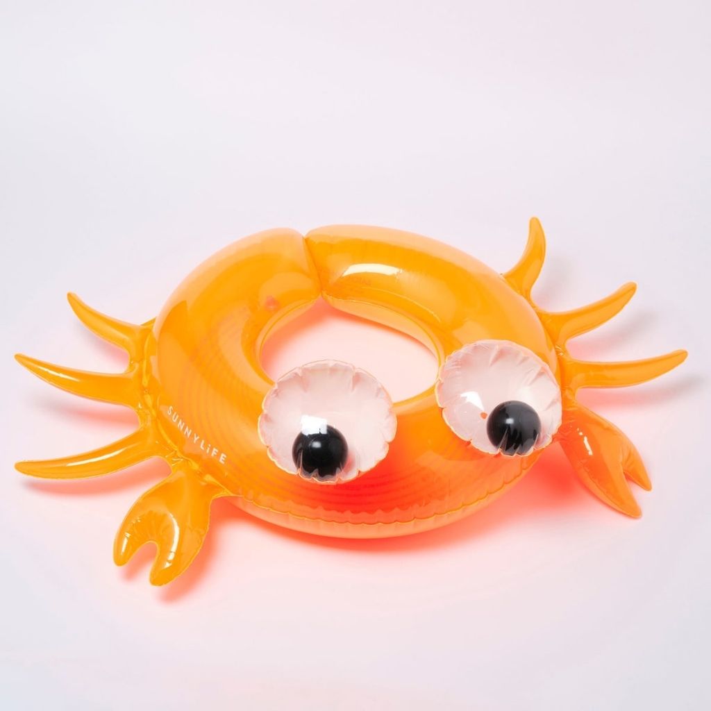 Product shot of the Sunnylife kiddy pool ring in sonny the sea creature neon orange
