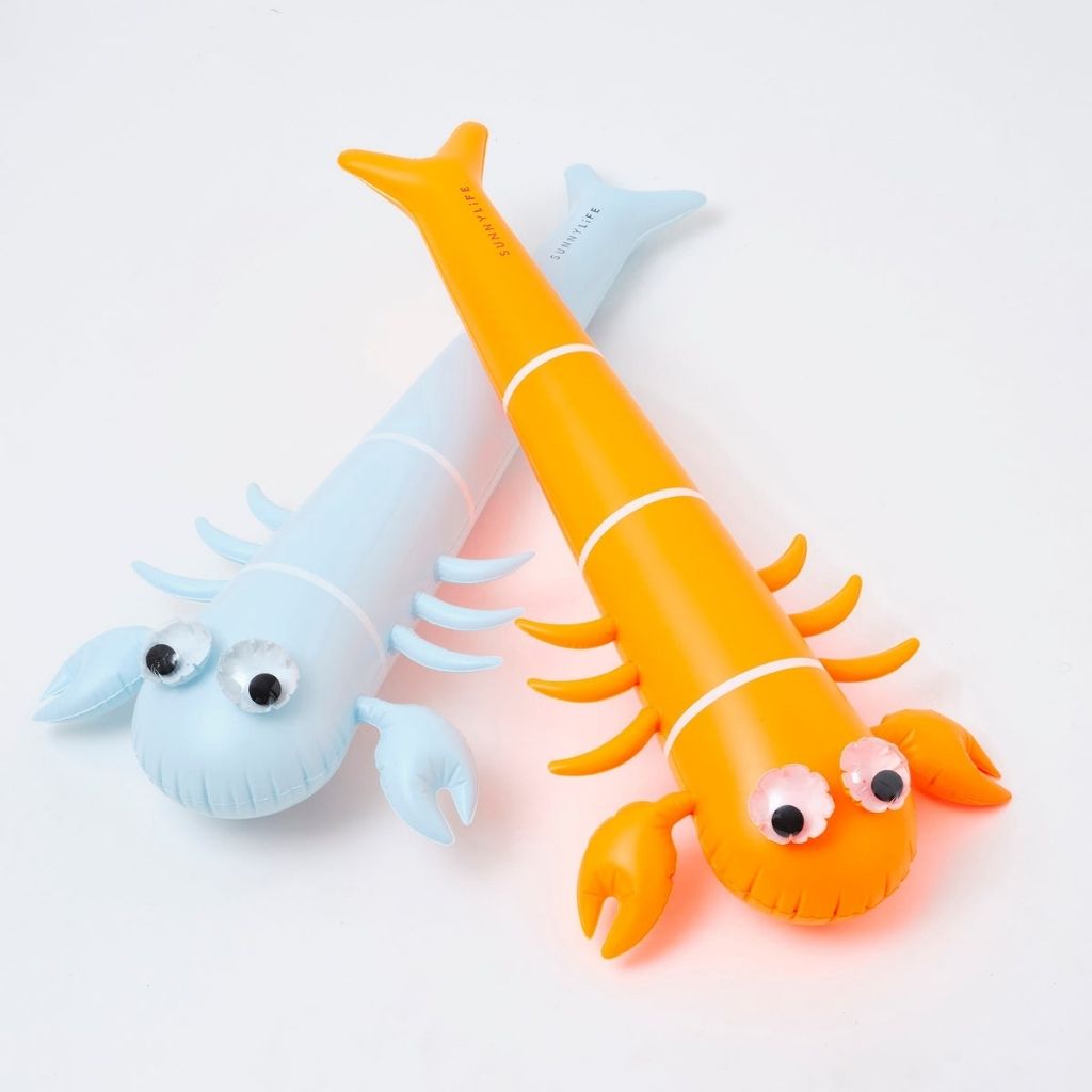 Close up of Sunnylife Kids inflatable noodle in sonny the sea creature neon orange set of two